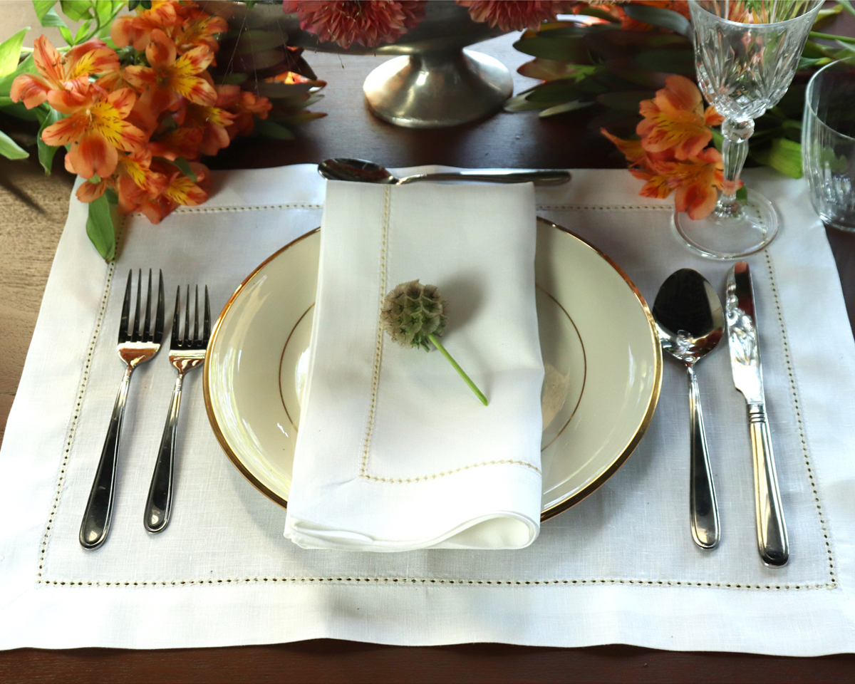 White and gold hemstitched linen napkin placemat set 